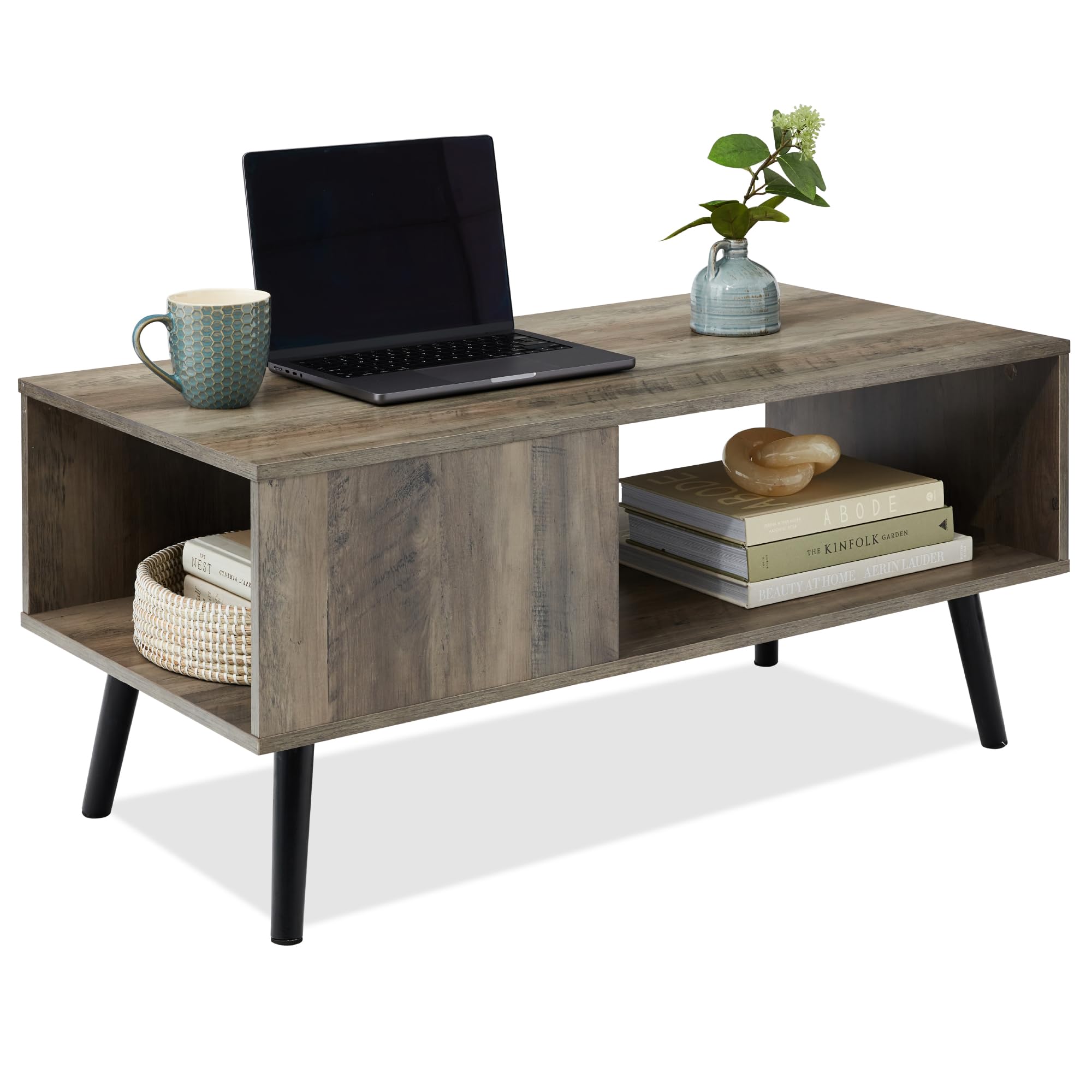 Gray coffee table with open shelf storage a basket and books on contrasting dark legs