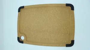 Cleaning a wood fiber cutting board with mild soap and a soft sponge